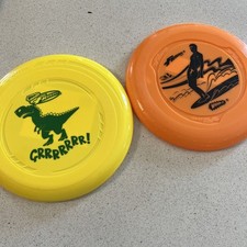 Lot of 2 Wham-O Frisbee Discs T-Rex  Surfer 2015, 2019 New