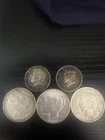 silver dollars and 1/2 dollar silver coin