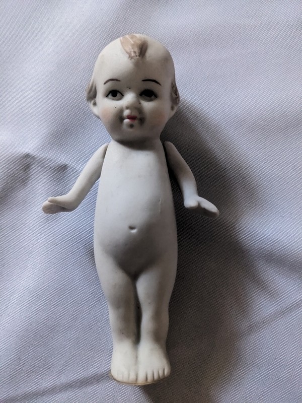 4 7/8" Bisque Kewpie type doll, Made in Japan stamped on his back, Jointed arms
