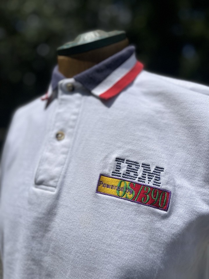 A deadstock-era polo from an IBM OS/390 x Equifax tech partnership — the kind of corporate artifact that turns a home office or dev den into a conversation piece.