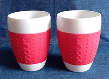 BODUM Pavina - 2 Becher PORZELLAN mit Silikonring in Rot - 0,35 l