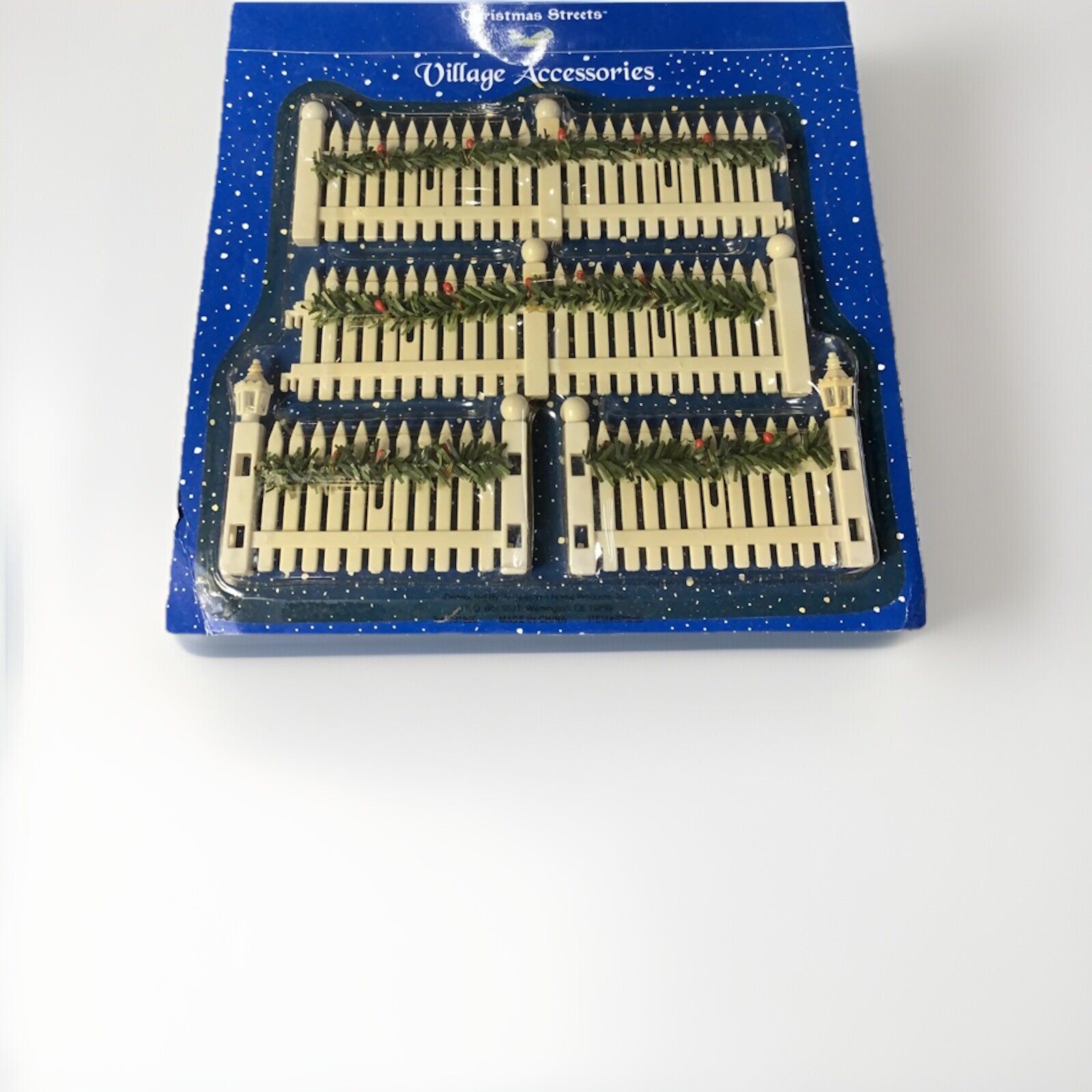 Festive White Picket Fence with Christmas Garland Decor