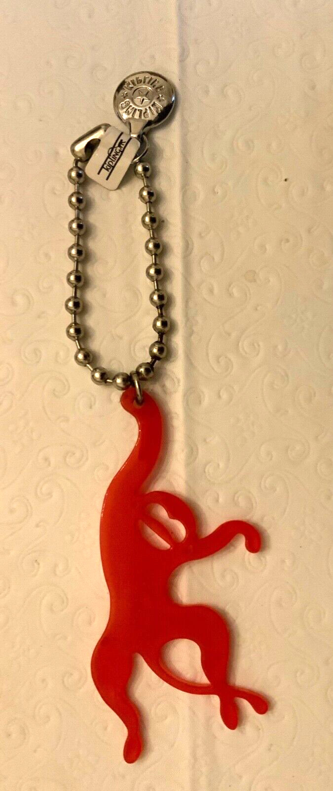 Kipling Red Plastic Monkey Keychain Silver Ball B… - image 1