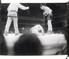 Champion Joe Louis stands over his fallen foe Max Schmeling of Ger- Old Photo