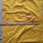 Yellow fabric Golden State Warriors NBA pillow case with 19 x 25 dimensions, shown with a wooden ruler for scale.