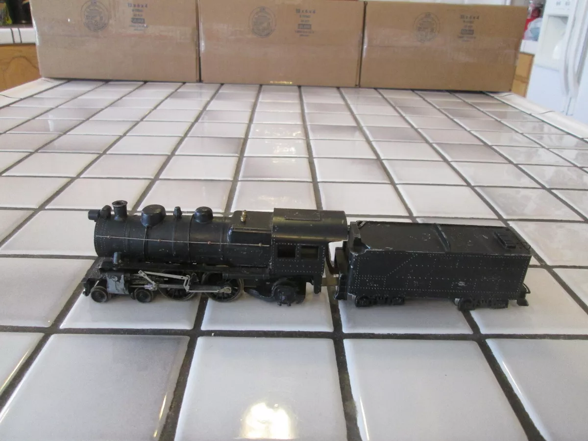 very old vintage mostly metal powered steam engine HO scale