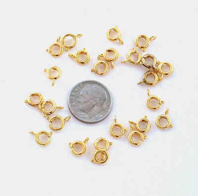 TWENTY FOUR 6mm GOLD PLATED SPRING RINGS CF45