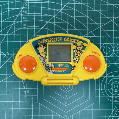 Tiger Handheld Electronic Game Inspector Gadget Yellow 1999 MPN 59-0050