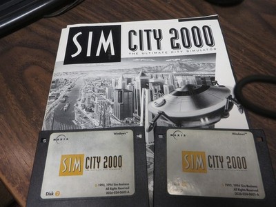SIM CITY 2000 VINTAGE SOFTWARE 2 FLOPPY DISCS AND MANUAL MAXIS