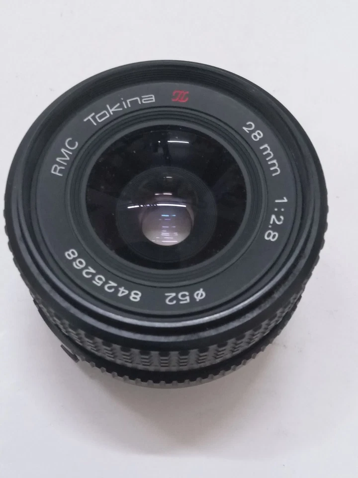 Lente gran angular RMC TOKINA 28 mm F2,8 en montura Minolta MD buena pero leída Foto 3 de 4