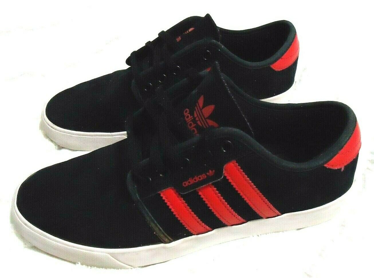 black shoes with red stripes