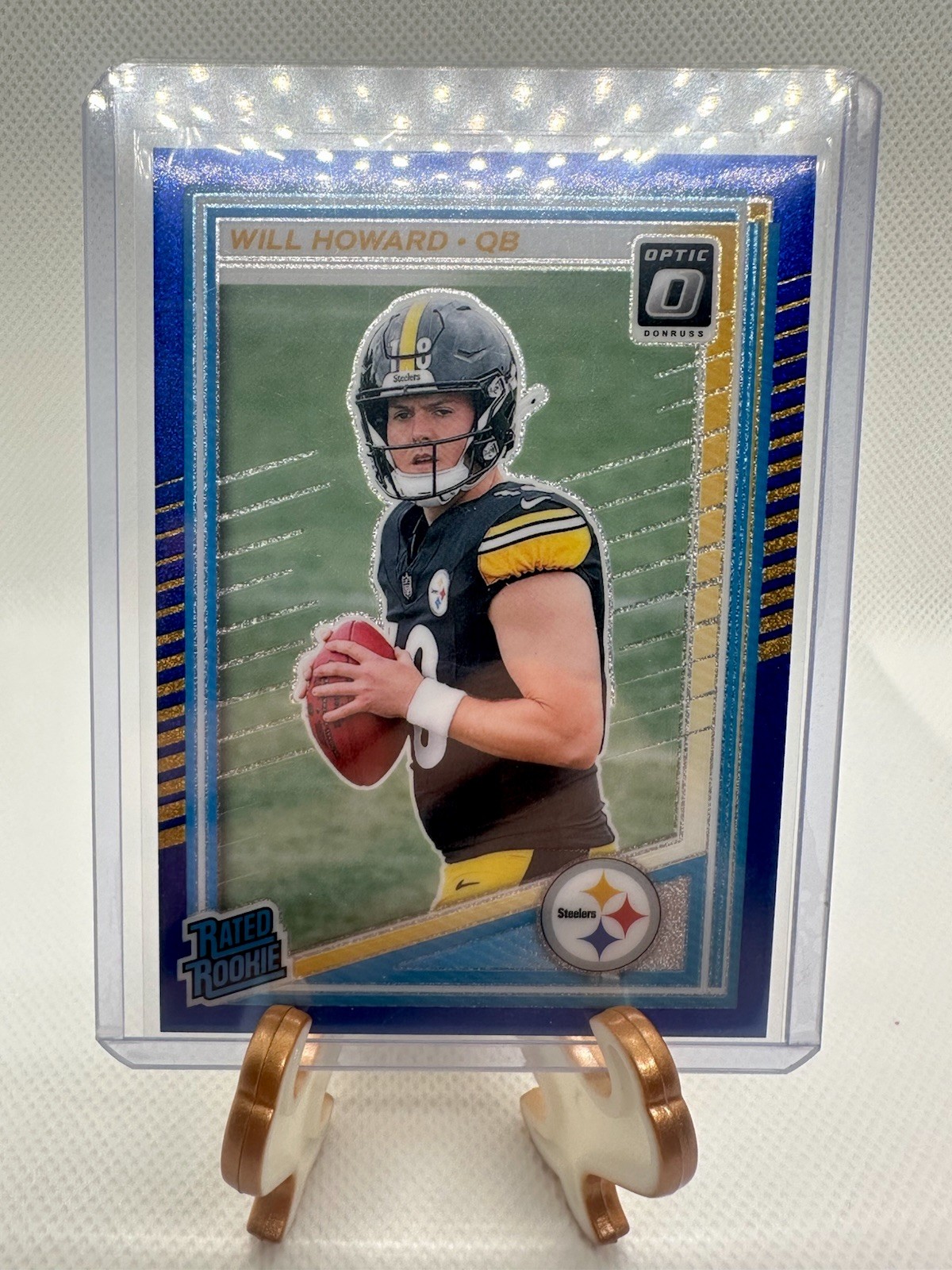 2025 Panini Optic - #233 Will Howard Rated Rookie - Blue Glitter / Case Hit Sp