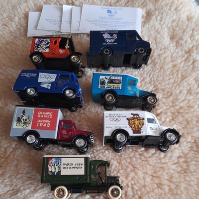 7 x LLEDO DELIVERY VANS - OLYMPISCHE SPIELE 1996 ATLANTA - SEHR GUTER ZUSTAND. OHNE BOXEN. LTD ED