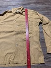 Light brown vintage Fruit Of The Loom men’s button up shirt size small with two chest pockets and red vertical measurement.