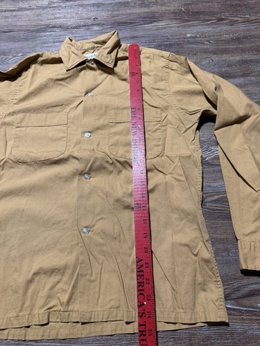 Light brown vintage Fruit Of The Loom men’s button up shirt size small with two chest pockets and red vertical measurement.