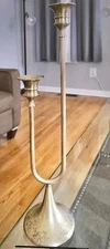 Solid brass trombone-style candlestick holder, likely vintage