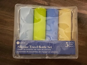 New In Box - Silicone travel bottle set Of 4 With Reusable Bag