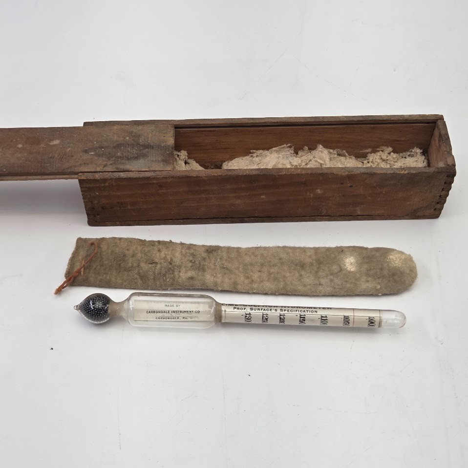 A purpose-built lime-sulphur hydrometer for orchard spraying, complete with its original wooden box — a charming, utterly forgotten piece of agricultural science history.