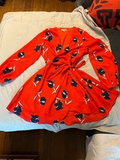 Gianni Bini wrap dress with flowers. Used but looks new. No rips or holes