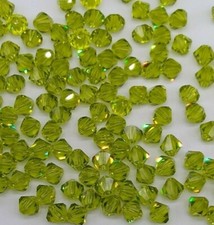 24pc Swarovski Crystal Light Olivine 5mm Bicone 5301 Beads; Olive Green