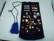 Seoul Olympic 1988 pin lot and dark blue NBC Olympics banner cloth.