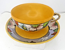 Vintage Japanese Lusterware Teacup And Saucer. Yellow inner cup, floral design.