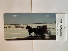Made in the USA! Winter Horse & Buggy Scene premium license plate.