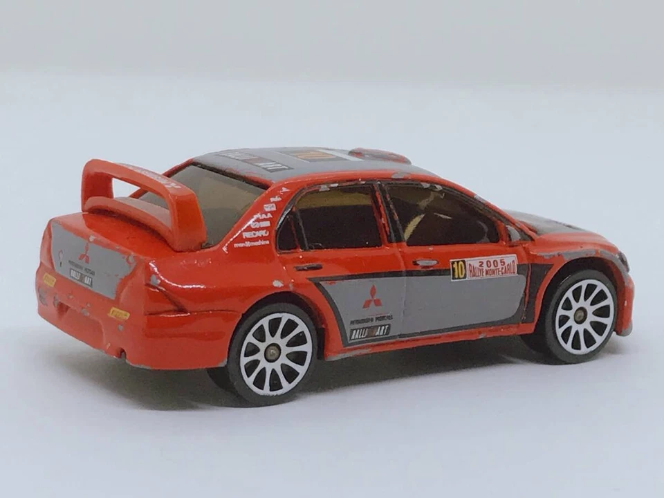 Un'auto pressofusa taglia 14 Tomica Majorette Mitsubishi Lancer WRC Ralliart ... - Immagine 2 di 4