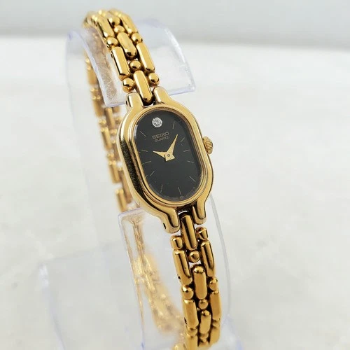 VINTAGE SEIKO 1E20-6039 OVAL TANK QUARTZ BLACK/GOLD DIAMOND 13MM WOMEN'S WATCH