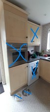 beech colour kitchen units and wall unit, hob, pull out wine rack