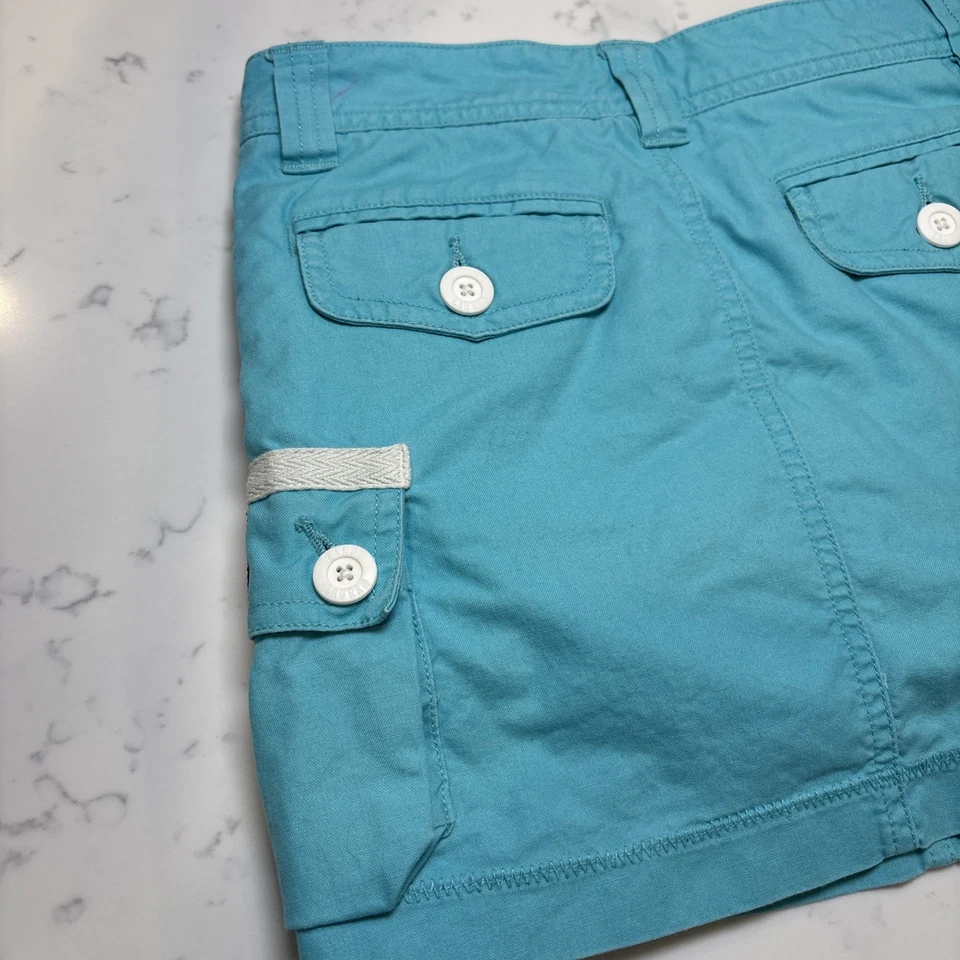 Falda corta vintage Ralph Lauren niñas turquesa bolsillos de carga botones blancos talla 8 Foto 4 de 4