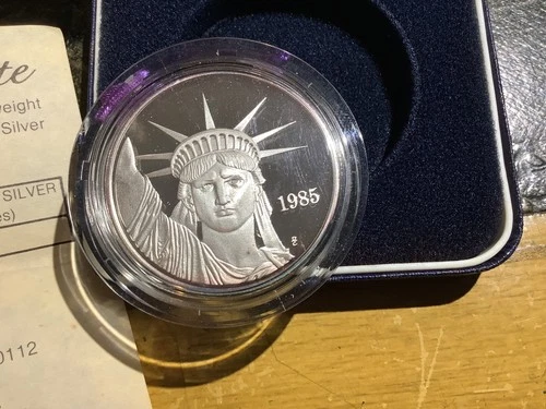 1985 1 oz MTB PROOF Liberty Trade Silver. COA. Nice Toning Reverse