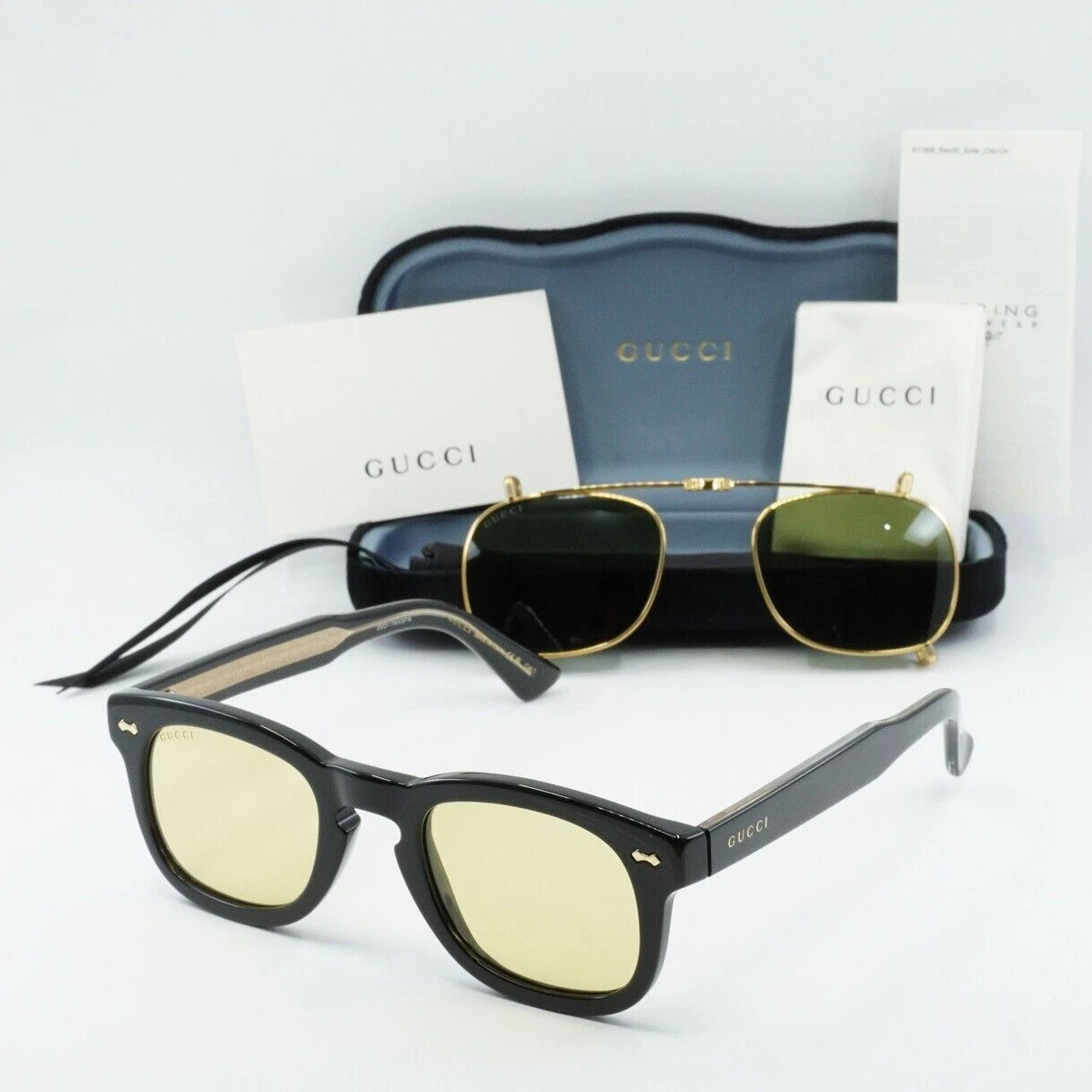 GUCCI GG0182S 008 Shiny Black With A Gold Rimmed Folding Clip-On 