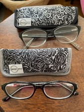 Design Optics by Foster Grant Black Plastic Frames 1.25. Two styles. 2 sleeves