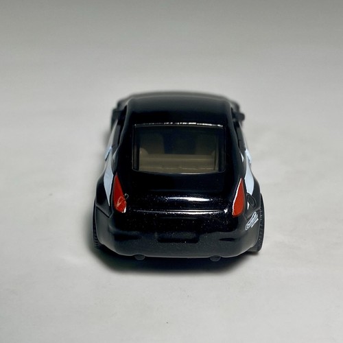 Matchbox Nissan Z (350Z) Pearl Black 1:64 modellino auto diorama pressofuso da collezione - Foto 8 di 12