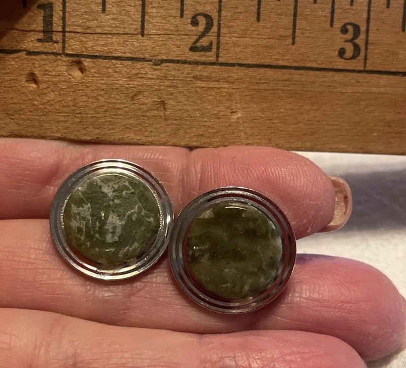 Vintage Cufflinks featuring a dark green, mottled gemstone. likely Jade.