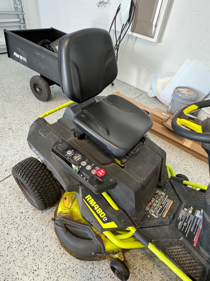 Ryobi RM480e Electric Riding Lawn Mower comes with 10 cu. Feet Steel