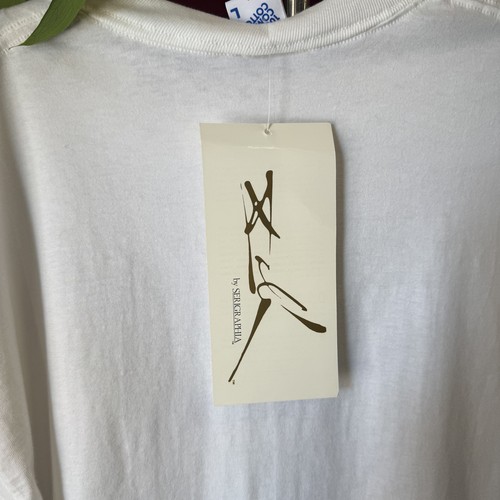 White short-sleeve Jerzees T-shirt with black “by Sergaphia” tag and logo, made in USA men’s XL.