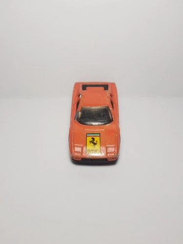 Vintage Matchbox Ferrari Testarossa, 1/59 scale 1986 damaged orange die-cast car