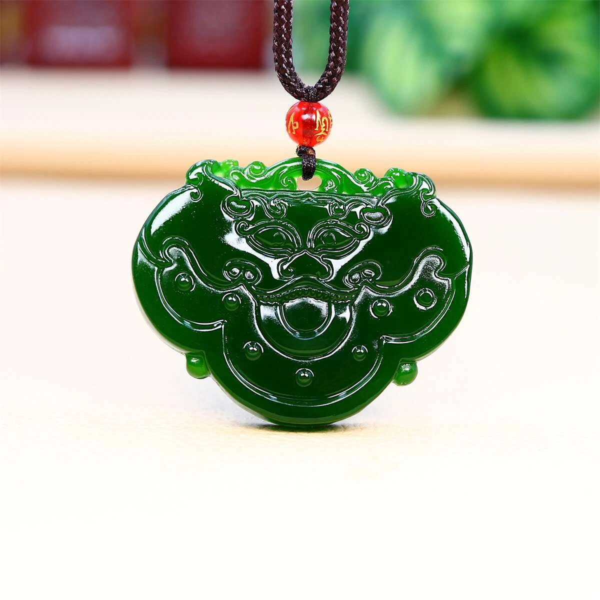 Carved jade shop dragon pendant