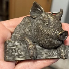 1981 PIG ON A FENCE BELT BUCKLE, by Bergamot, solid brass, USA