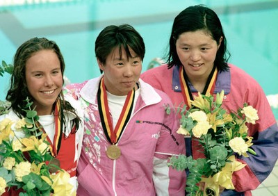 Gold medalist Qian Hong of China poses alongside silver medalist W- Old Photo