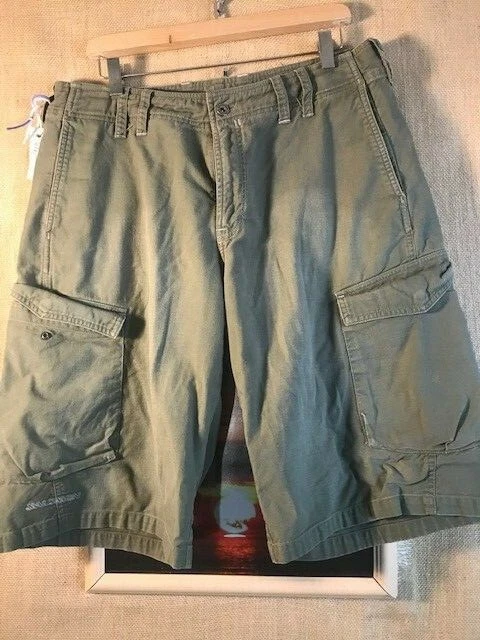 Short Salomon da uomo verde piatto frontale solido misura 34 x 13 5"" con cerniera cotone