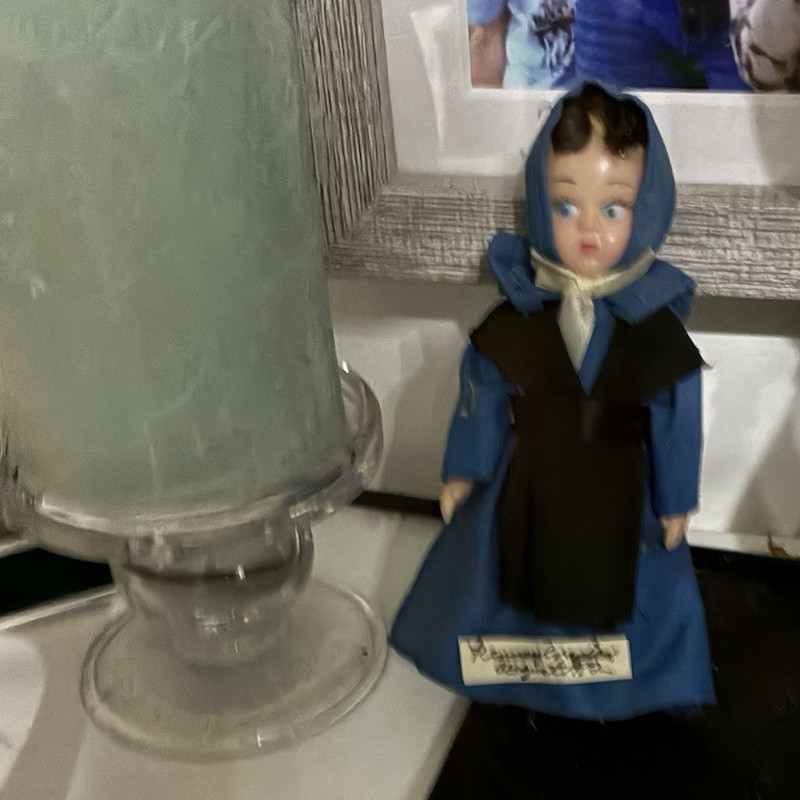 Small Blue & Black Doll Figurine with Blue Dress and Bonnet