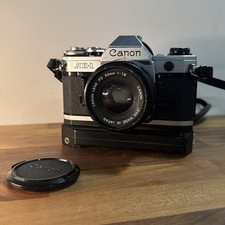  Nice  Canon AE-1 35mm SLR Film Camera w/ Canon Lens FD 50mm 1:1.8 Tested Works