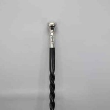 Elegant walking stick, twisted cane, wood and metal, black and silver Designer