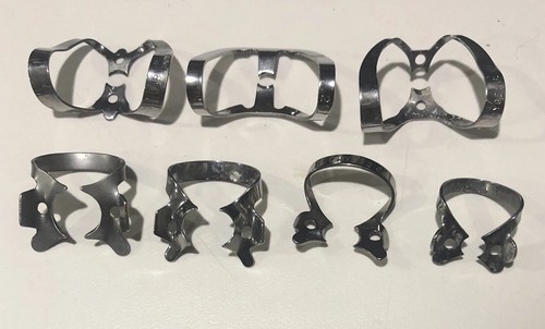 Lot of 7 Ivory Dental Rubber DAM Clamps