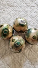 Pier 1 decorative gold balls with peacock feather print