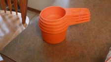 Vtg Tupperware Orange Measuring cups 4 Pc Set- used