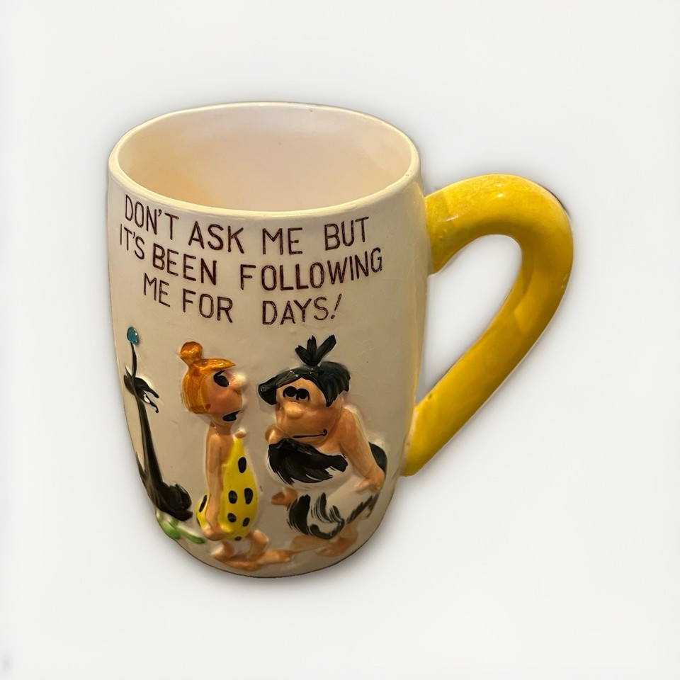 A Kreiss-era ceramic mug shaped like a Flintstones caveman — a genuine piece of 1960s licensed novelty pottery that straddles pop culture collectible and functional drinkware.